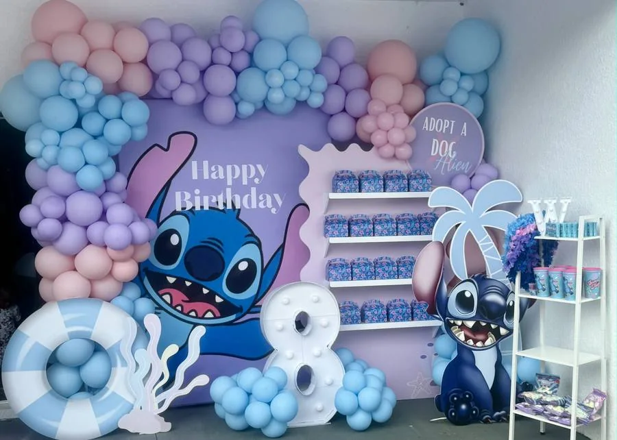 Colorful character birthday backdrop and balloon decor